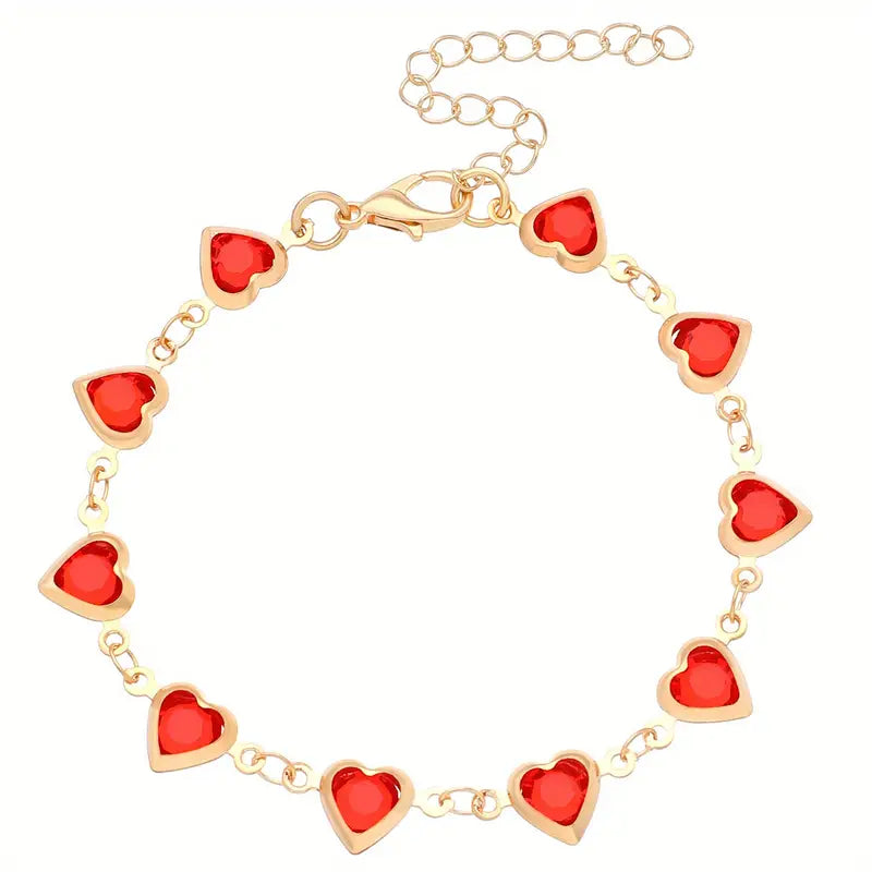 Elegante gouden armband met subtiele garnet steentjes