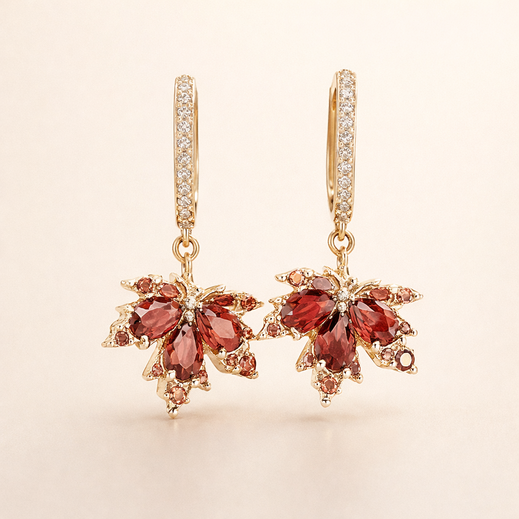 Elegante gouden oorbellen met zirkonia bladmotief