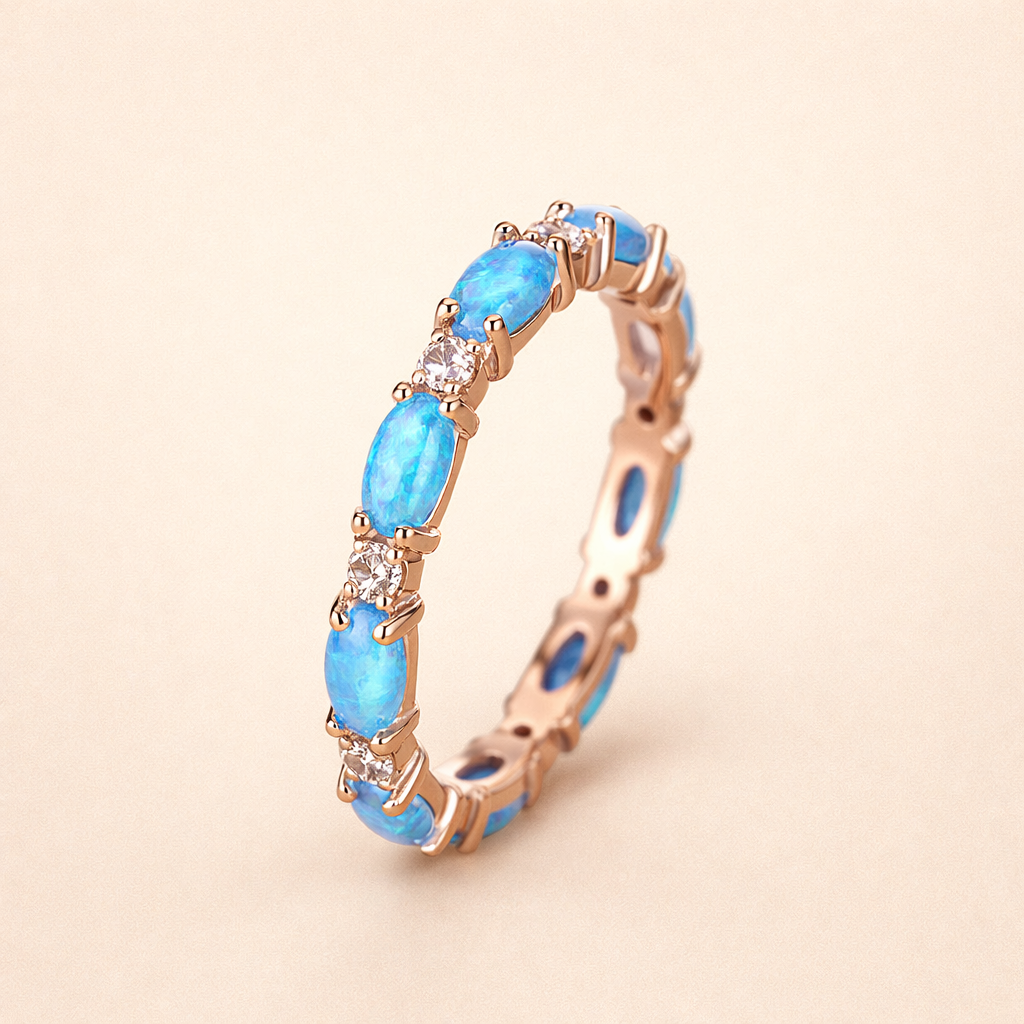 Zachte gouden ring met blauwe opaal
