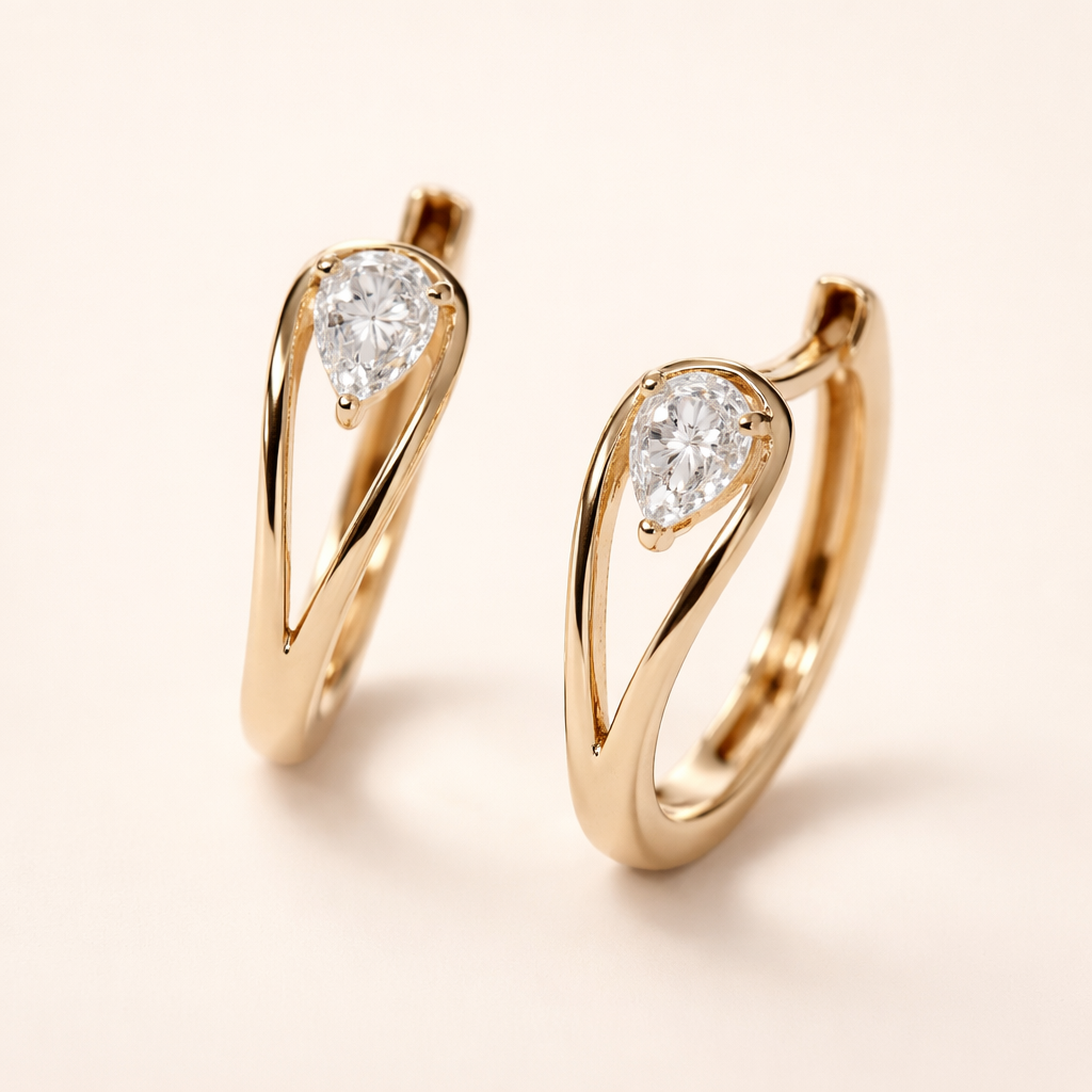 Elegante gouden druppel oorbellen met zirkonia