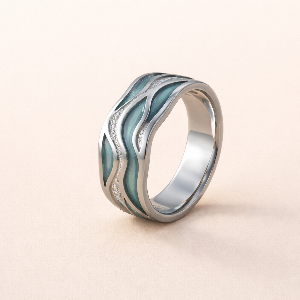 Zilveren ring met golvend design en turquoise accenten