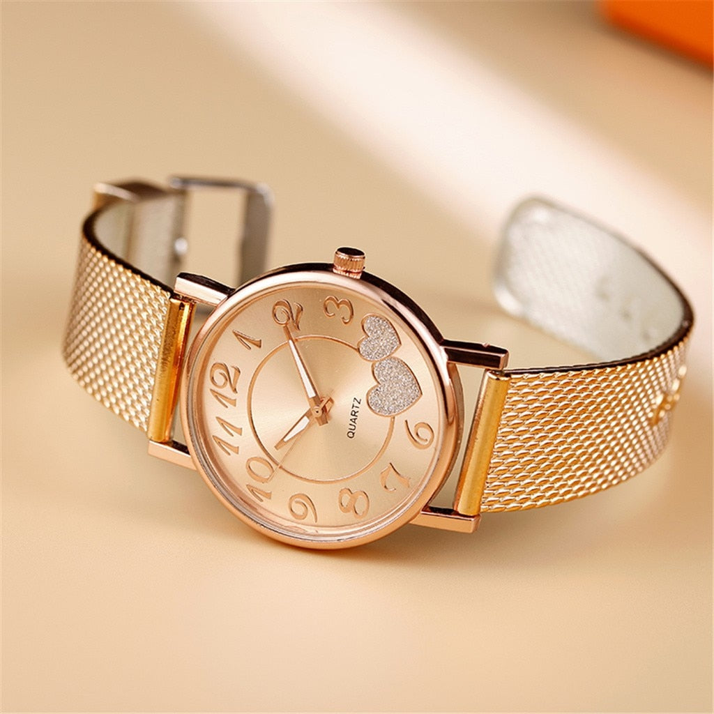 Minimalistische roségouden horloge met subtiele parel