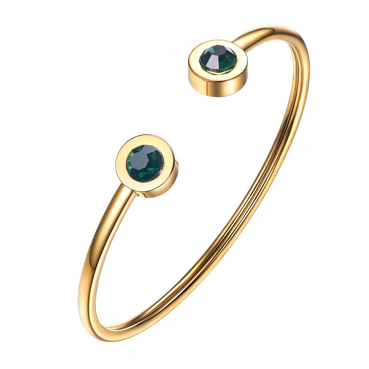 Elegante gouden armband met groene accenten
