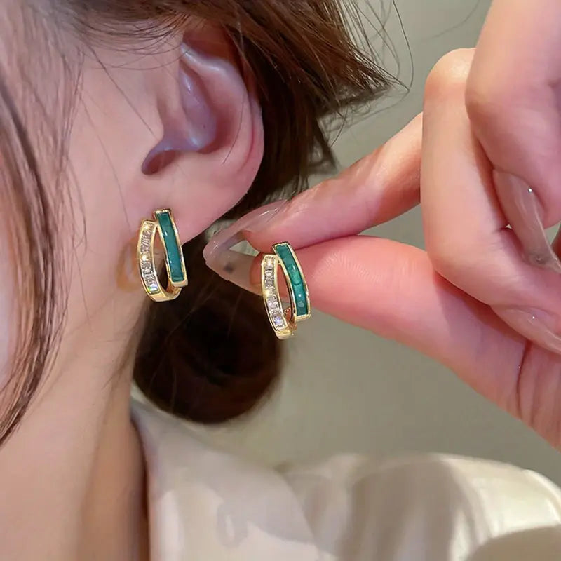 Elegante gouden oorbellen met bladeren