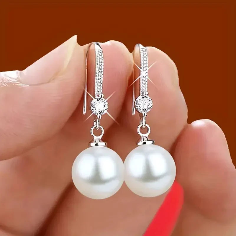 Elegante parel oorbellen met zirkonia in wit goud