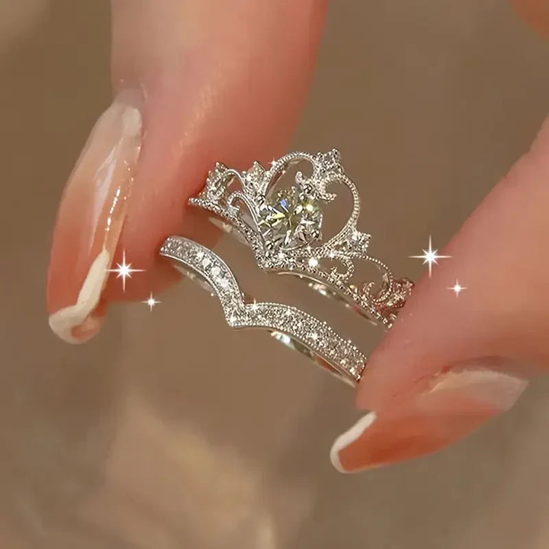 Elegante zilveren ringset met glanzende kroon