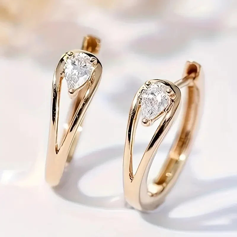 Elegante gouden druppel oorbellen met zirkonia