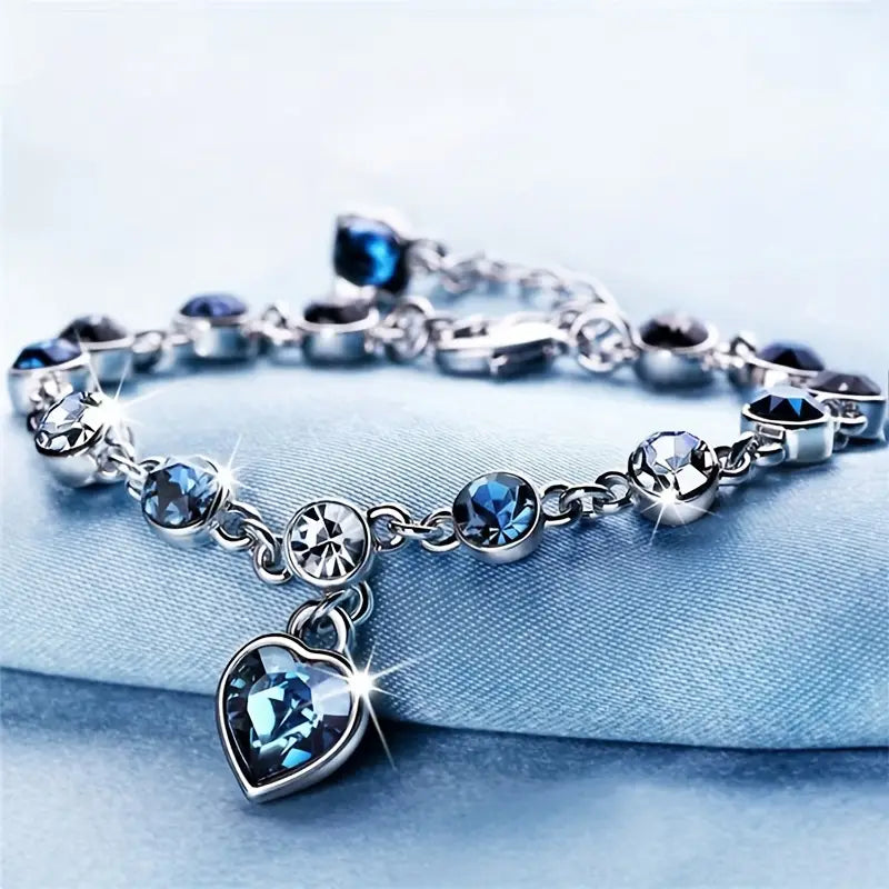 Zachte glans armband van wit goud met hartje