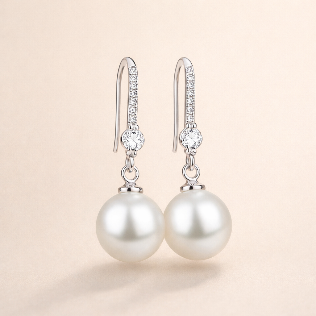 Elegante parel oorbellen met zirkonia in wit goud