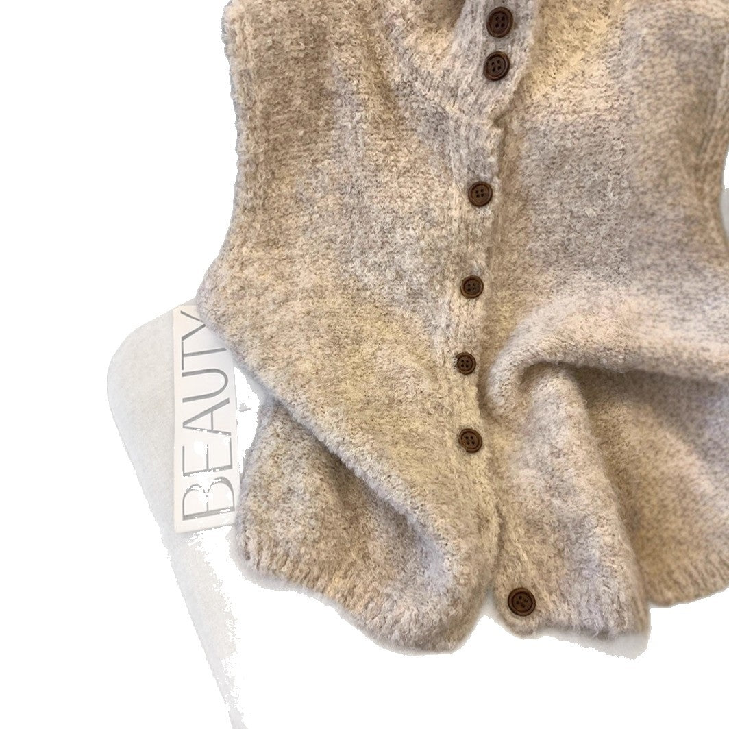 Gilet dames met fijn breisel en elegante knopen